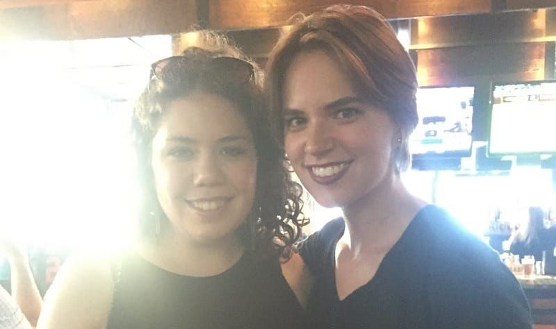 Flourish and Elizabeth smile at the camera