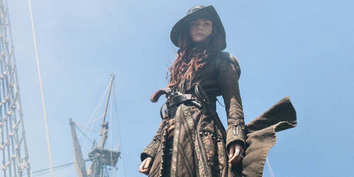Image of Anne Bonny with a ship's mast in the background.