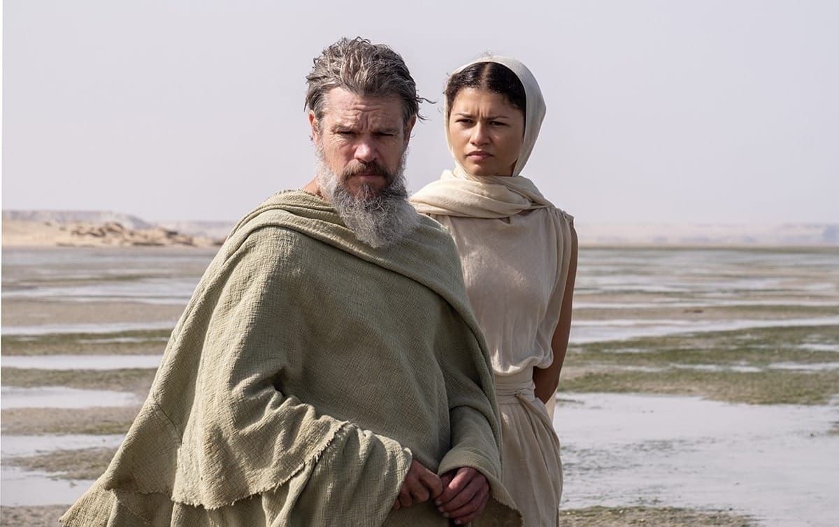 Production still featuring Odysseus and Athena on a beach