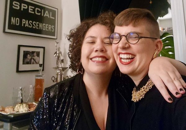 Photograph of Elizabeth and Flourish in black outfits with sparkly details.