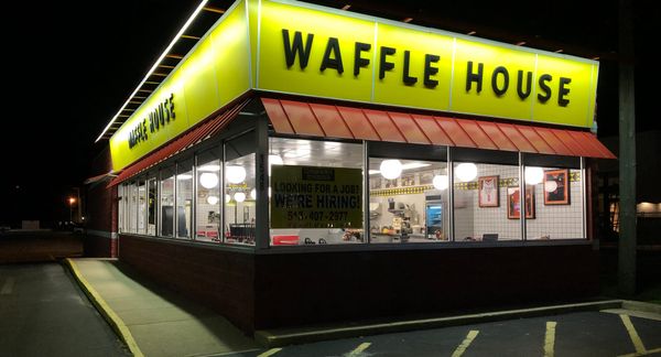 An exterior shot of a Waffle House restaurant. 