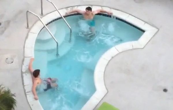 Screengrab from the famous vine which filmed two men in a hot tub from above while the filmer sings, "Two bros chilling in the hot tub five feet apart cuz they're not gay."