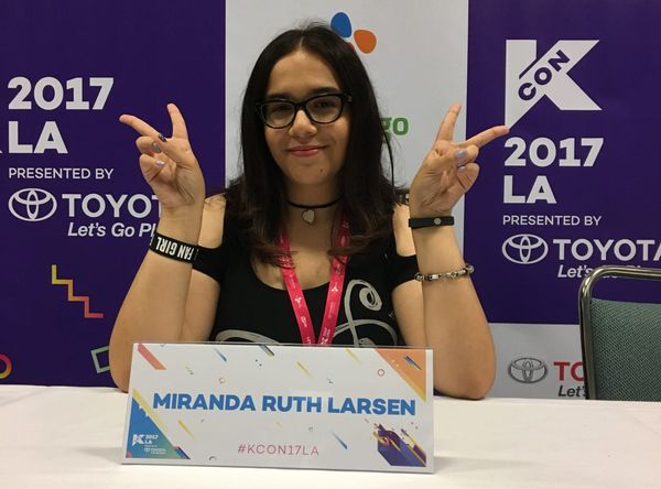  Photograph of Miranda Ruth Larsen sitting at a table at K-Con 
