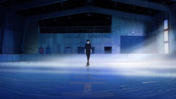 Screengrab from Yuri on Ice featuring Yuri in all black in the center of an ice rink.