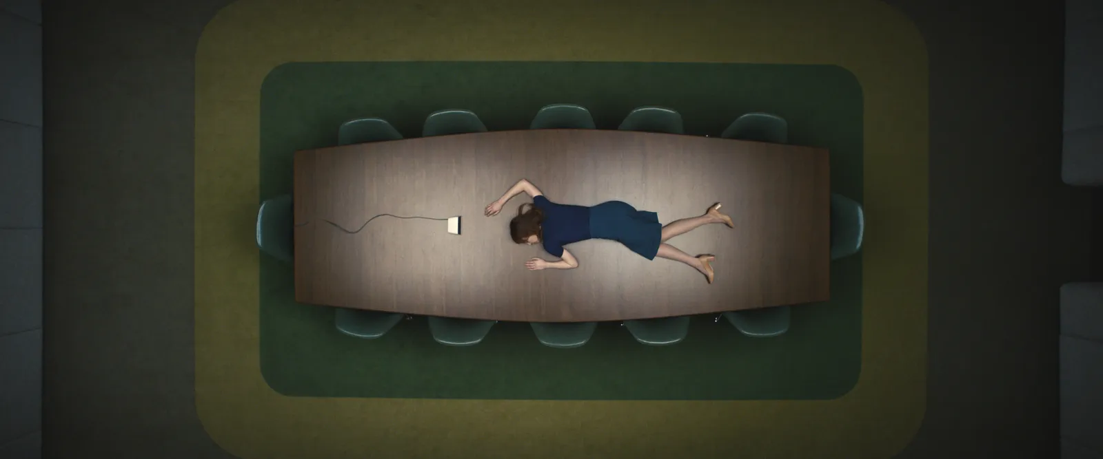 Woman in a navy dress and heals lays passed-out on top of a large office table. The room is otherwise empty and lowly lit.