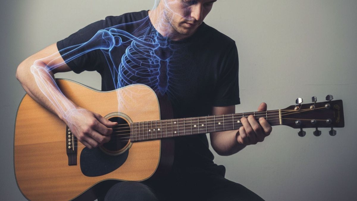 Musician playing guitar with good posture to prevent guitar playing pain 