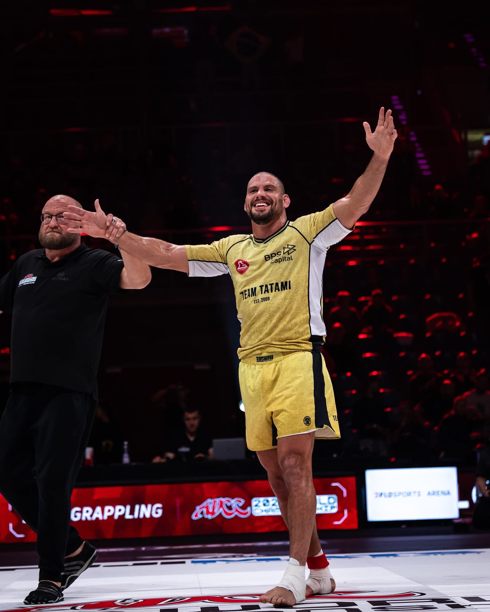 Felipe Pena raises his arms as the referee declares his victory at ADCC 2026 in Krakow.
