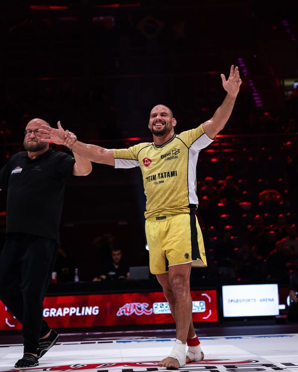 Felipe Pena raises his arms as the referee declares his victory at ADCC 2026 in Krakow.