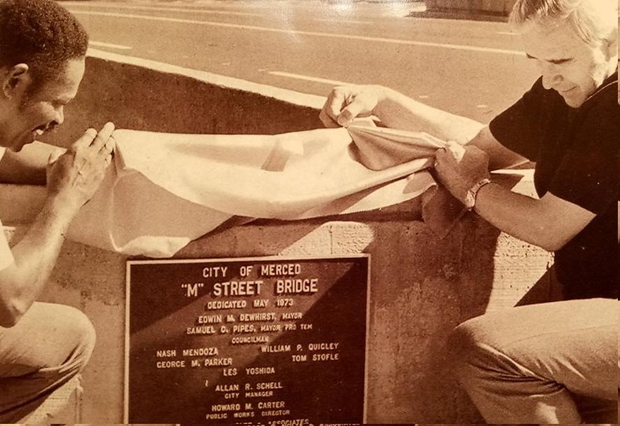  Merced Mayor Pro Tem Sam Pipes and Mayor Edwin Dewhirst view the plaque commemorating the opening of the M Street Bridge over Bear Creek in August 1973.  The plaque remains at the bridge.  It cost under three-hundred thousand dollars to build fifty years ago.  Photo:  Merced Courthouse Museum 