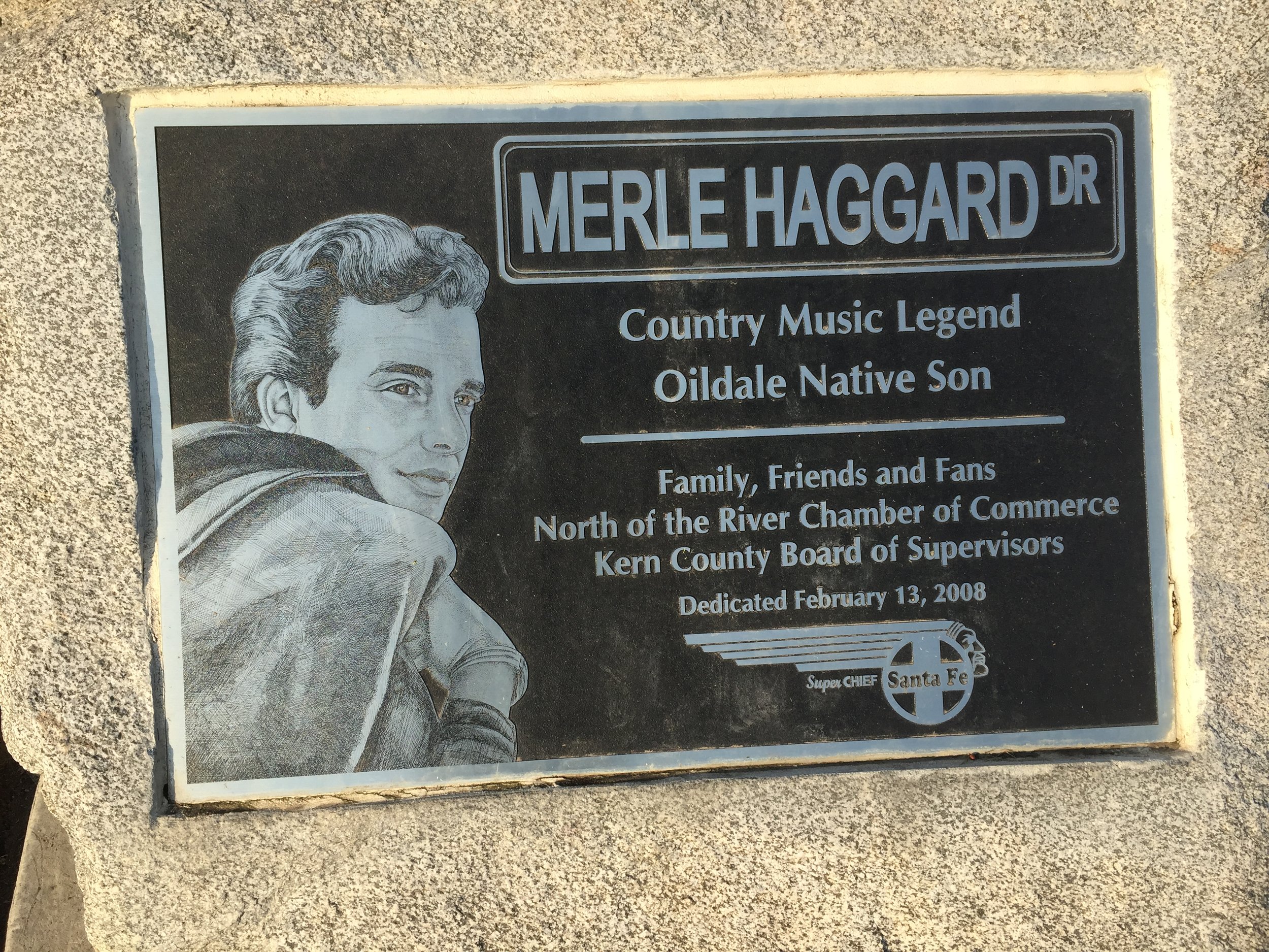  A plaque honoring Merle Haggard sets in front of a Harley Davidson dealership north of the City of Bakersfield. Photo: Steve Newvine 
