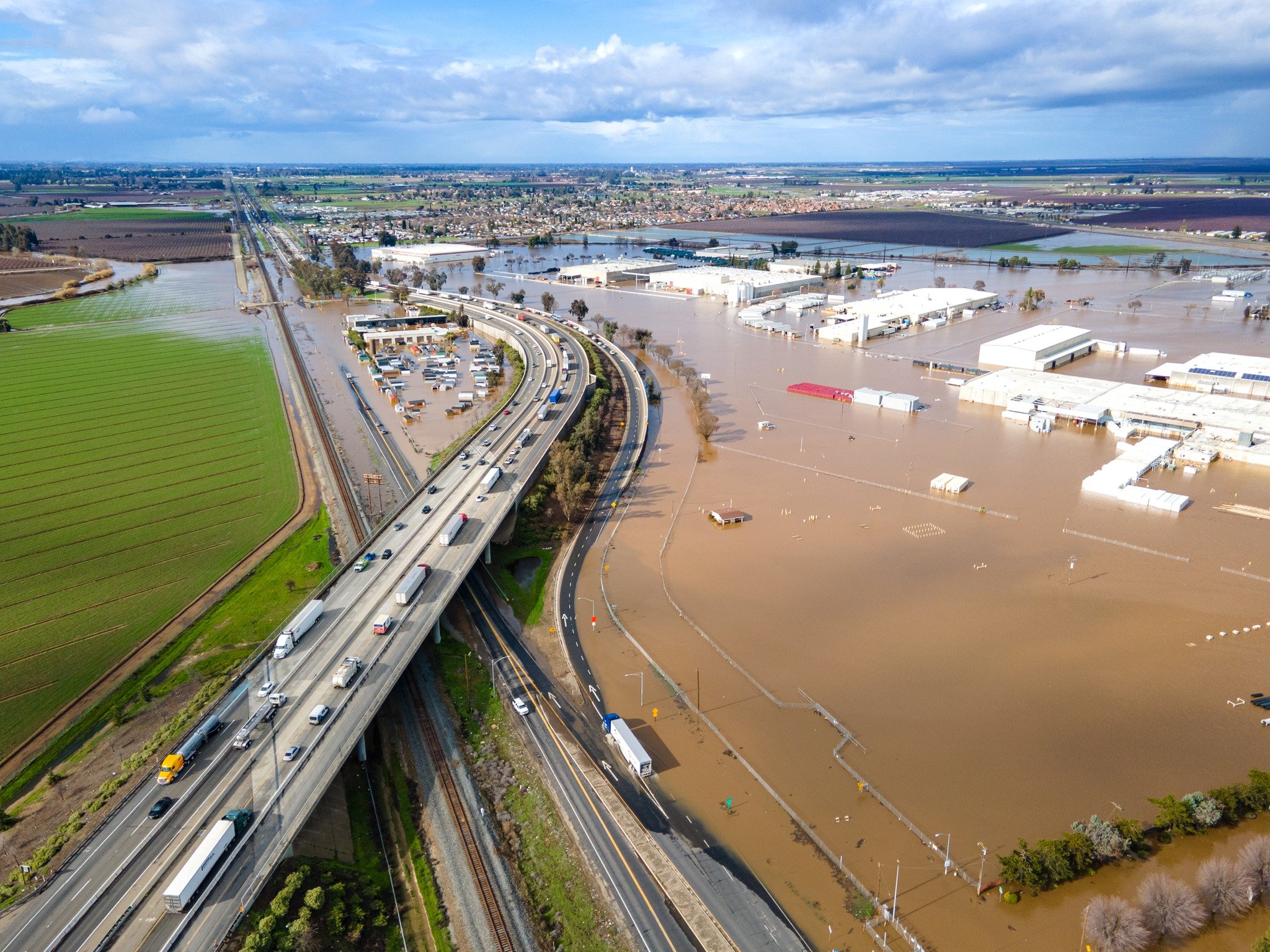  This photo provided by the County of Merced, shows how flood waters covered lower land near Ashby Road off California Highway 99.  Photo:  County of Merced Facebook page. 