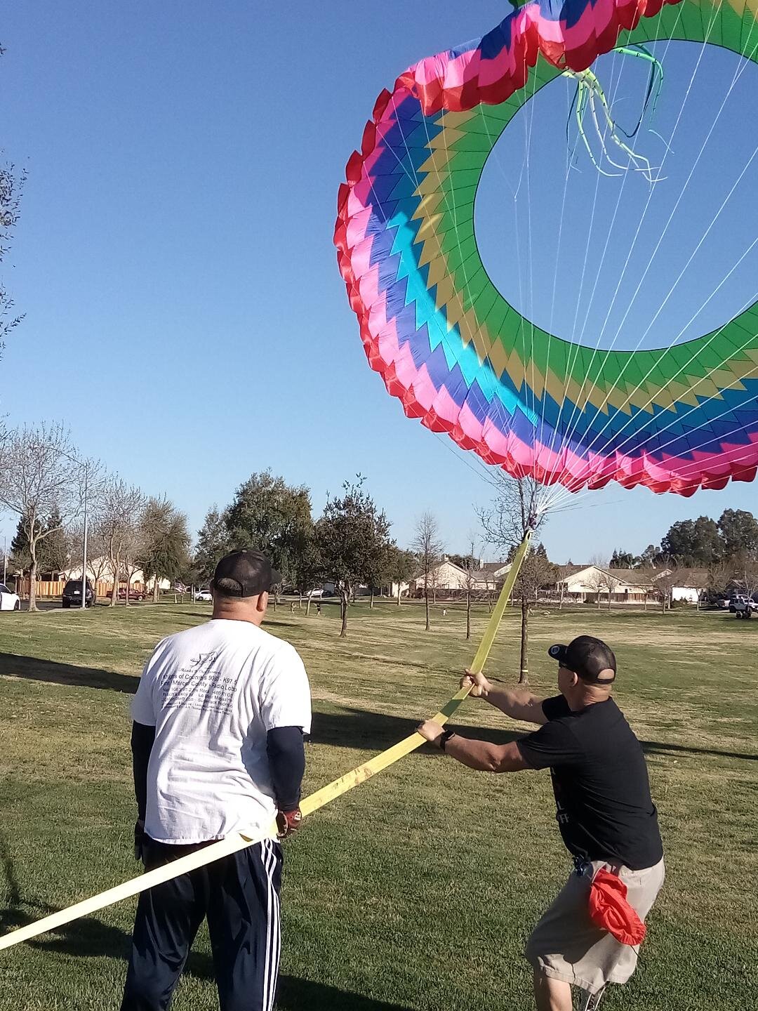  Mike and Rob Macias steady a big kite in Merced. Photo: Steve Newvine 