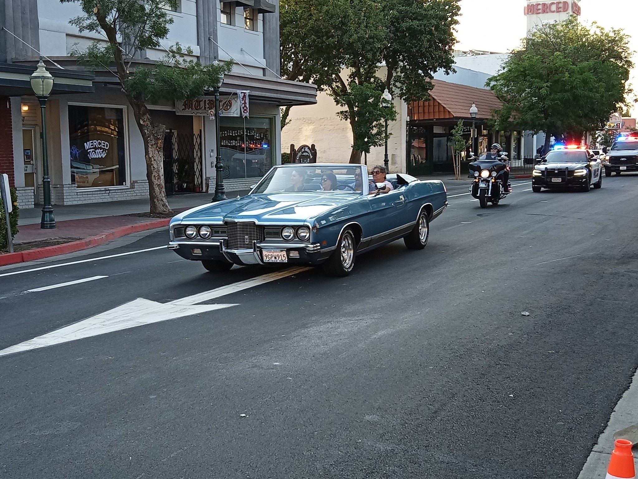  This classic convertible leads a city Police Department array of vehicles that were part of the cruise down Main Street.  Photo:  Steve Newvine 