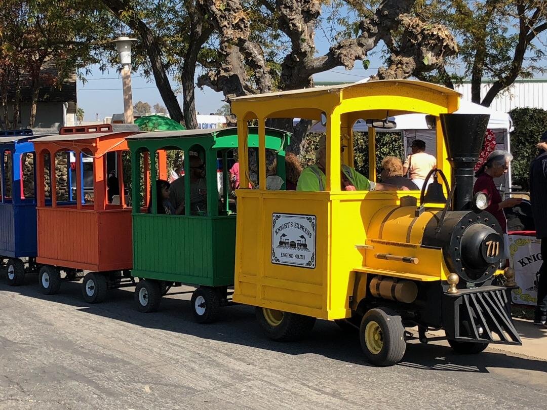  Children enjoy a mini-train ride as part of the Merced County Nut Festival. Photo: Steve Newvine 