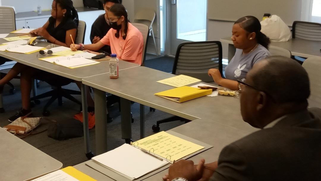  Retired Merced County Director of Workforce Development Robert Morris helps students in the Summer Prep Academy research what they need to do in order to pursue their preferred career paths.  Photo:  Steve Newvine 