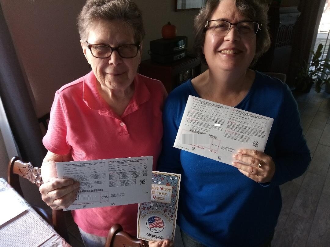  Two of the three voters in our household, my mother-in-law and my wife, show their ballots minutes before the envelopes were taken to the Merced County Board of Elections. Photo: Newvine Personal Collection 