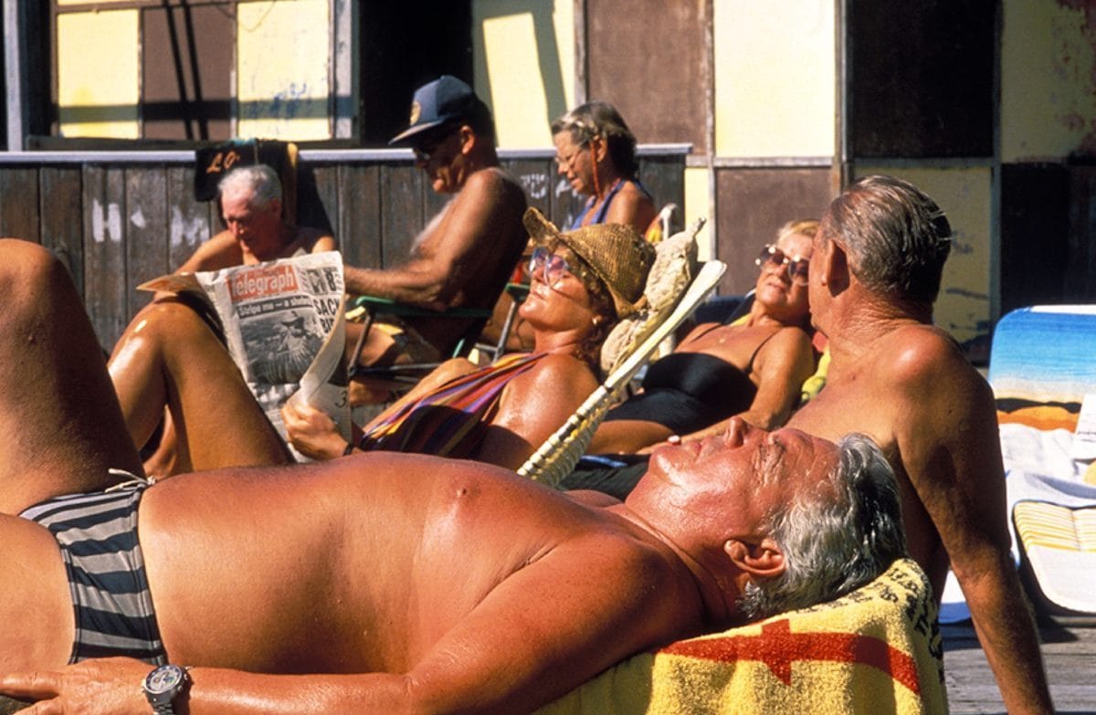 Sunbathers relaxing on the deck at Wylies Baths, Coogee
