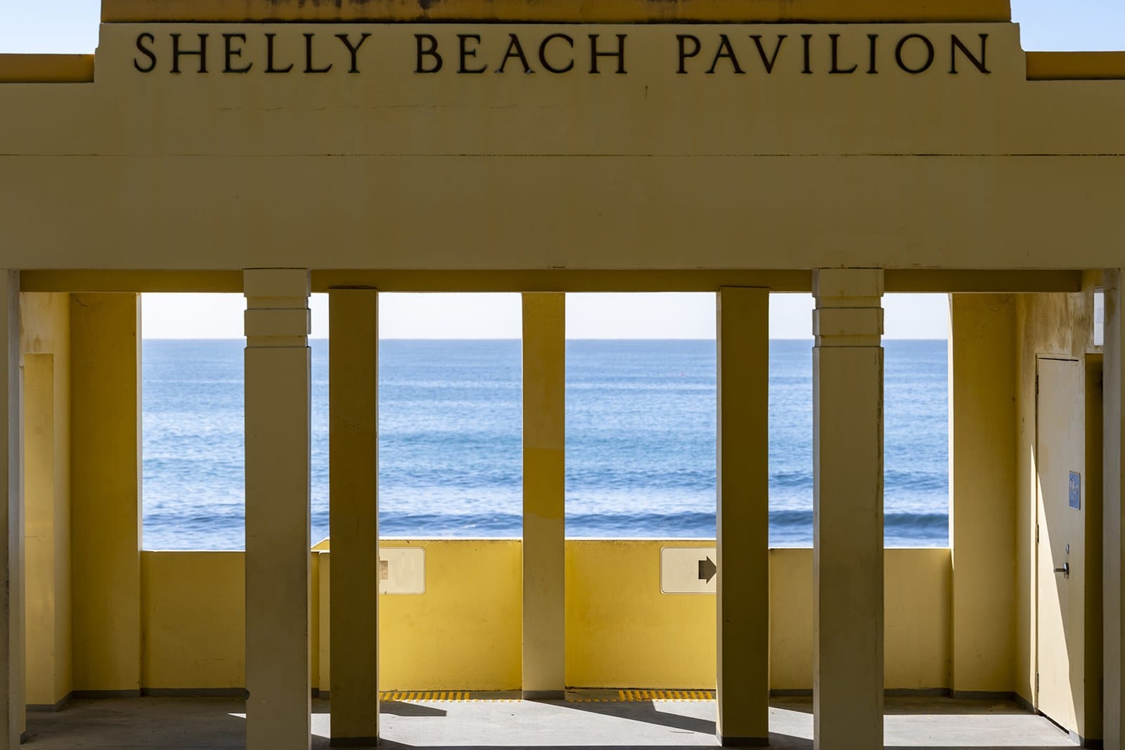 Shelly Beach Pavilion, Cronulla, its yellow columns framing the sea