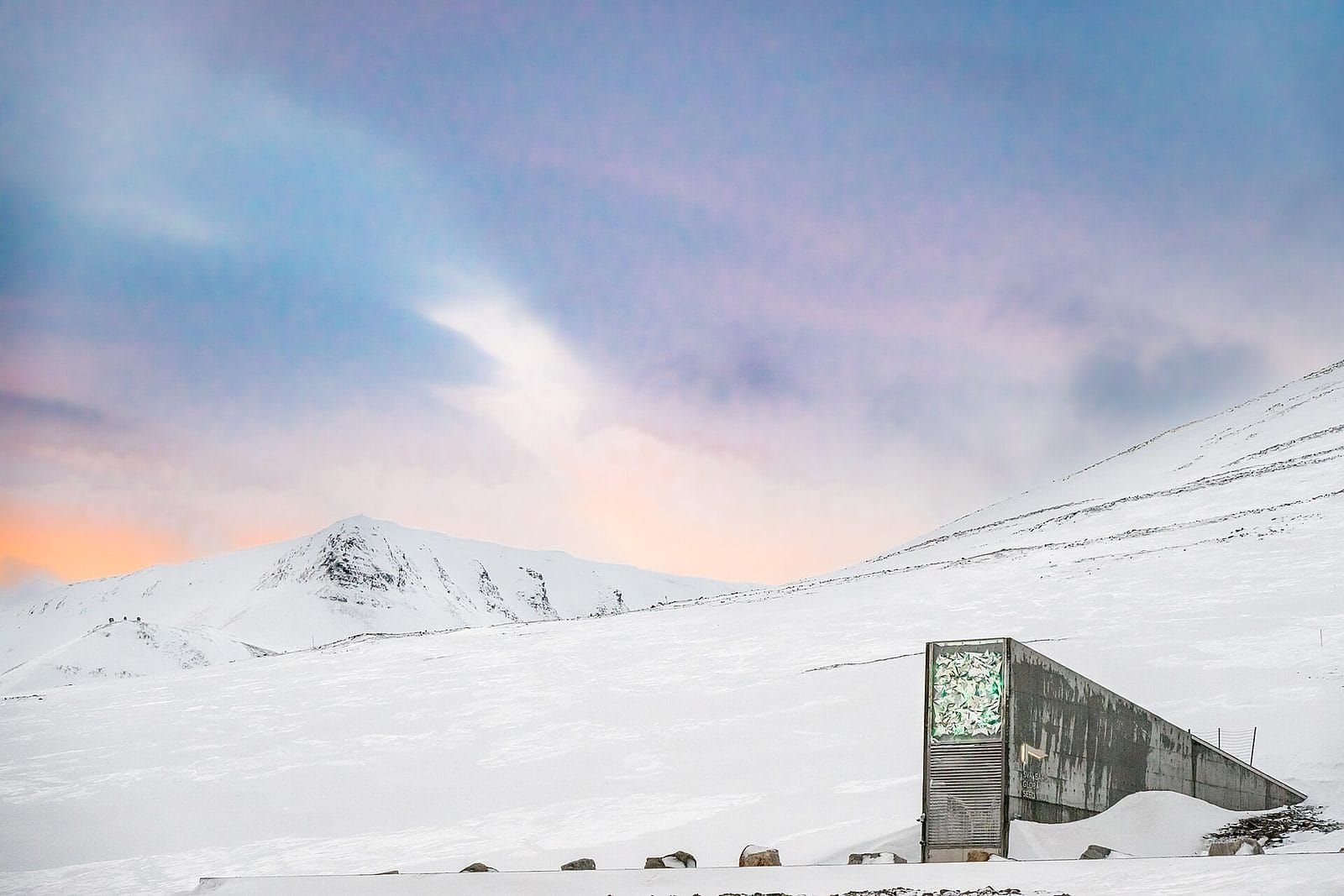 The entrance to a seed vault built into a snow covered Arctic mountainside