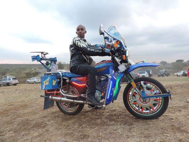 A boda boda motorbike taxi rider on a street in Nairobi, Kenya.
