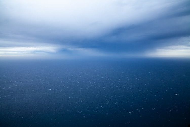 Open ocean under a wide sky, far from any coastline