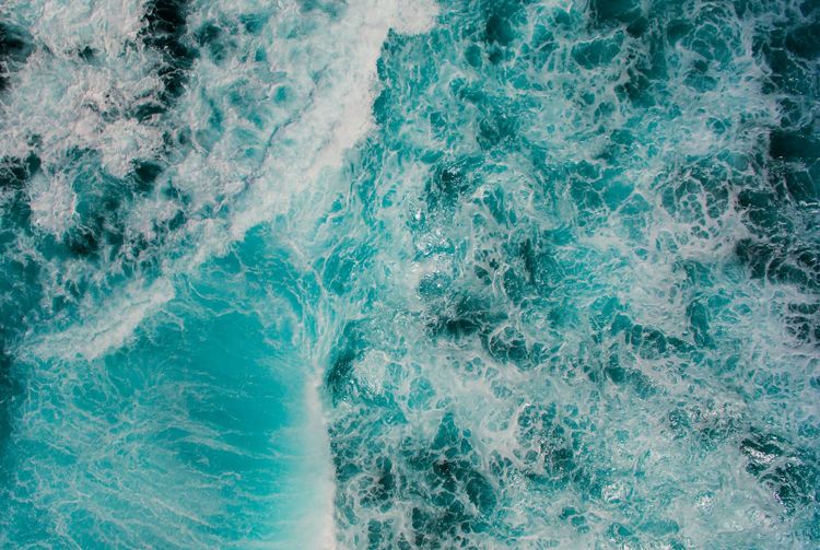 Bright turquoise ocean water seen from above
