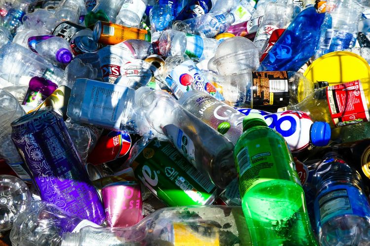Colourful plastic bottles and cans shining in bright sunlight