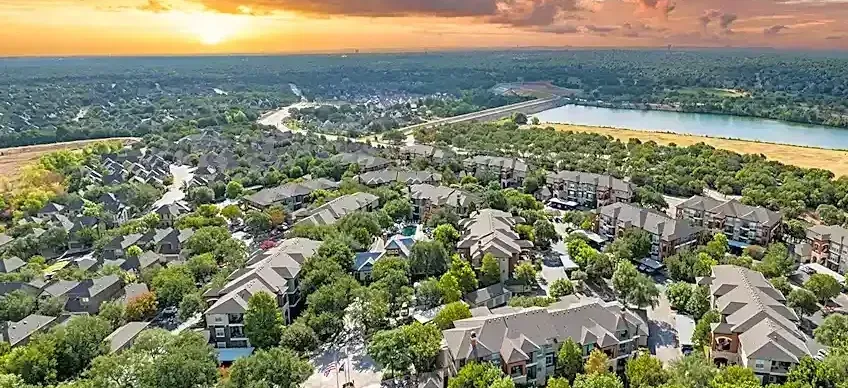 Brushy Creek Neighborhood of Austin Metro. Suburban Homes on Tree-Lined Streets. Lake in the Background. 