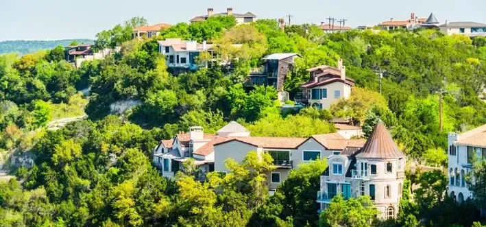 Spanish Style Palatial Homes in the Tree-Filled Hills of West Lake Hills