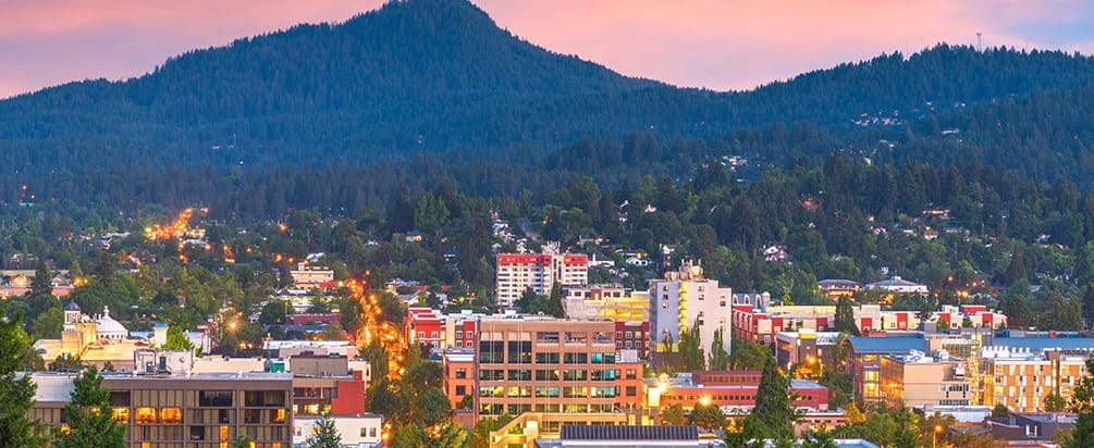 Aerial View of Eugene, Oregon with City of Oregon in the foreground and the Mount Pisgah is in the background. 