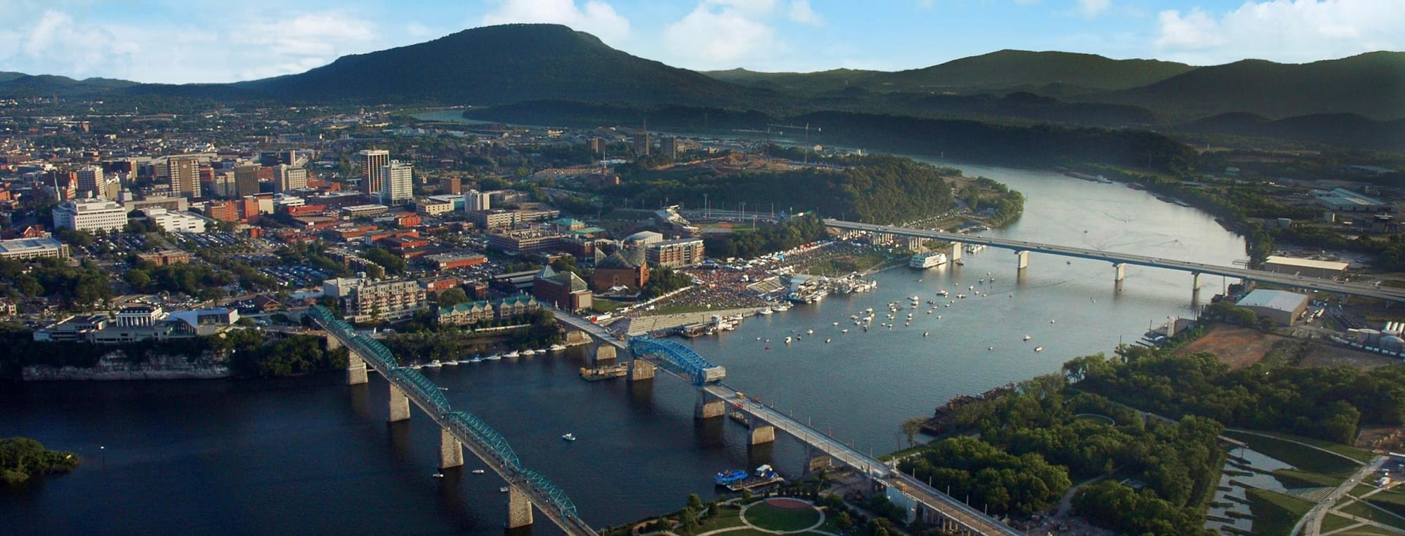Aerial View of Chattanooga and the Tennessee River. River in the foreground with the three bridges crossing into the city which is in the background on the other side of the river. 