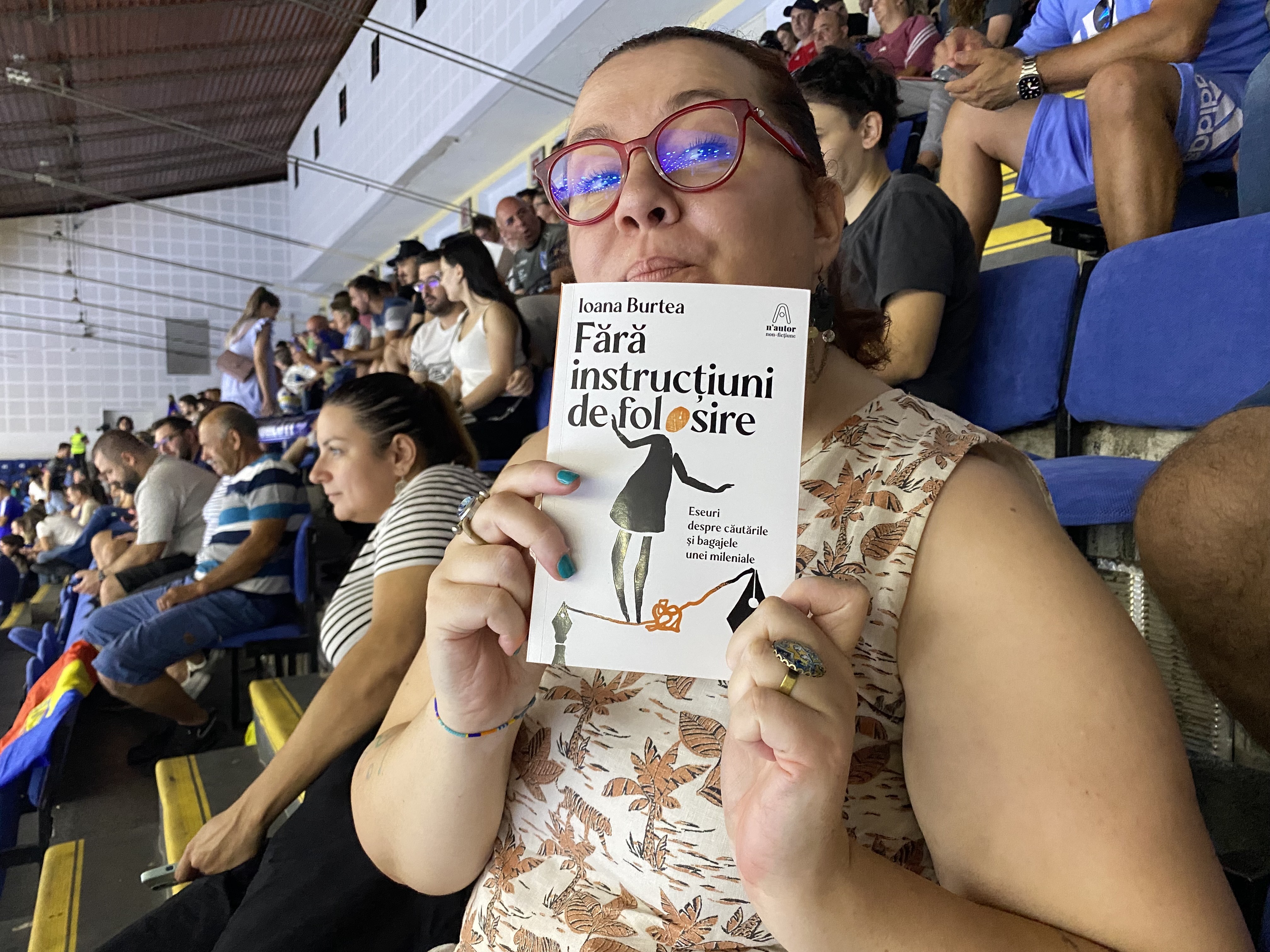 Author Ioana Burtea posing with her newly released collection of essays.