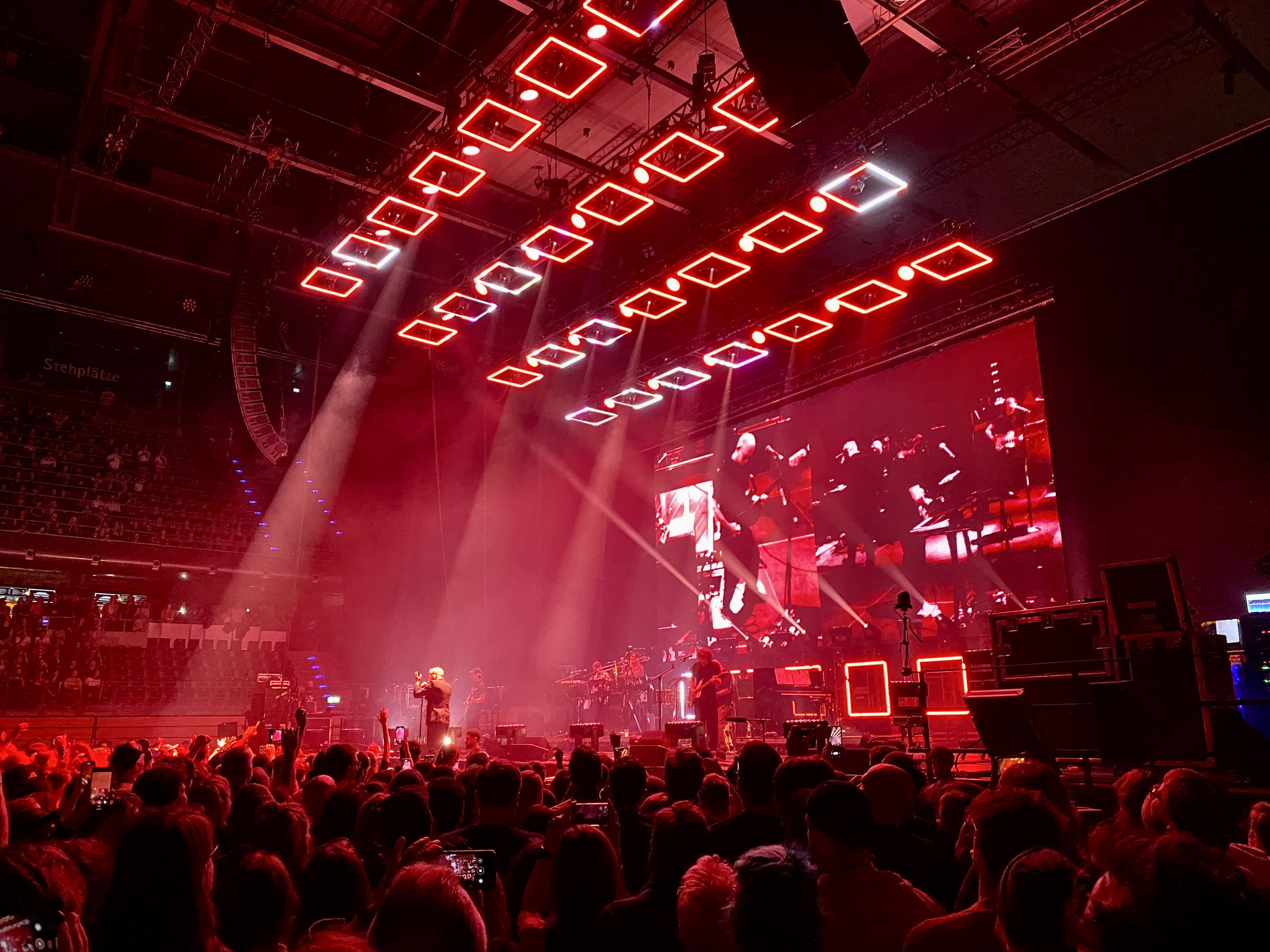 The National on stage, bathed in red lights, playing Bloodbuzz Ohio in Berlin on September 30.