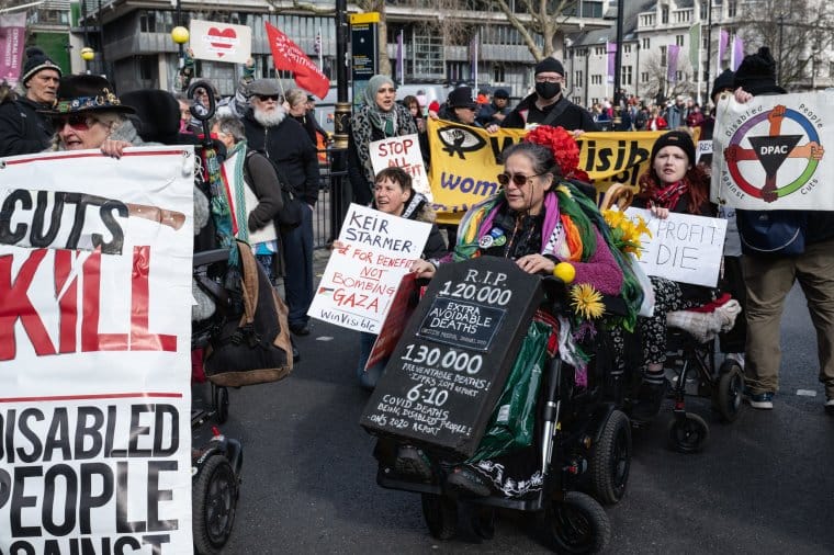 Disabled people protesting against UK government cuts
