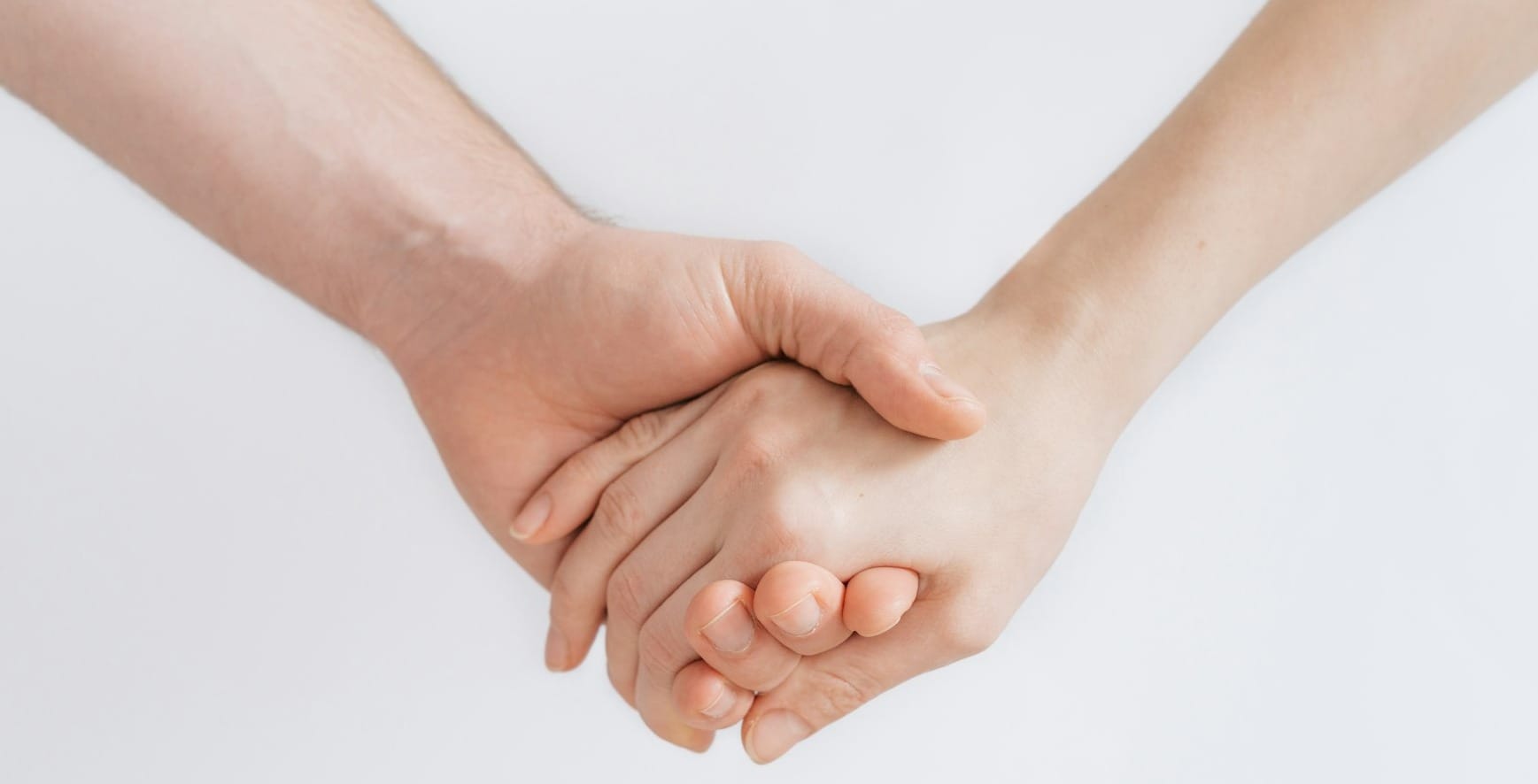 woman and man holding hands