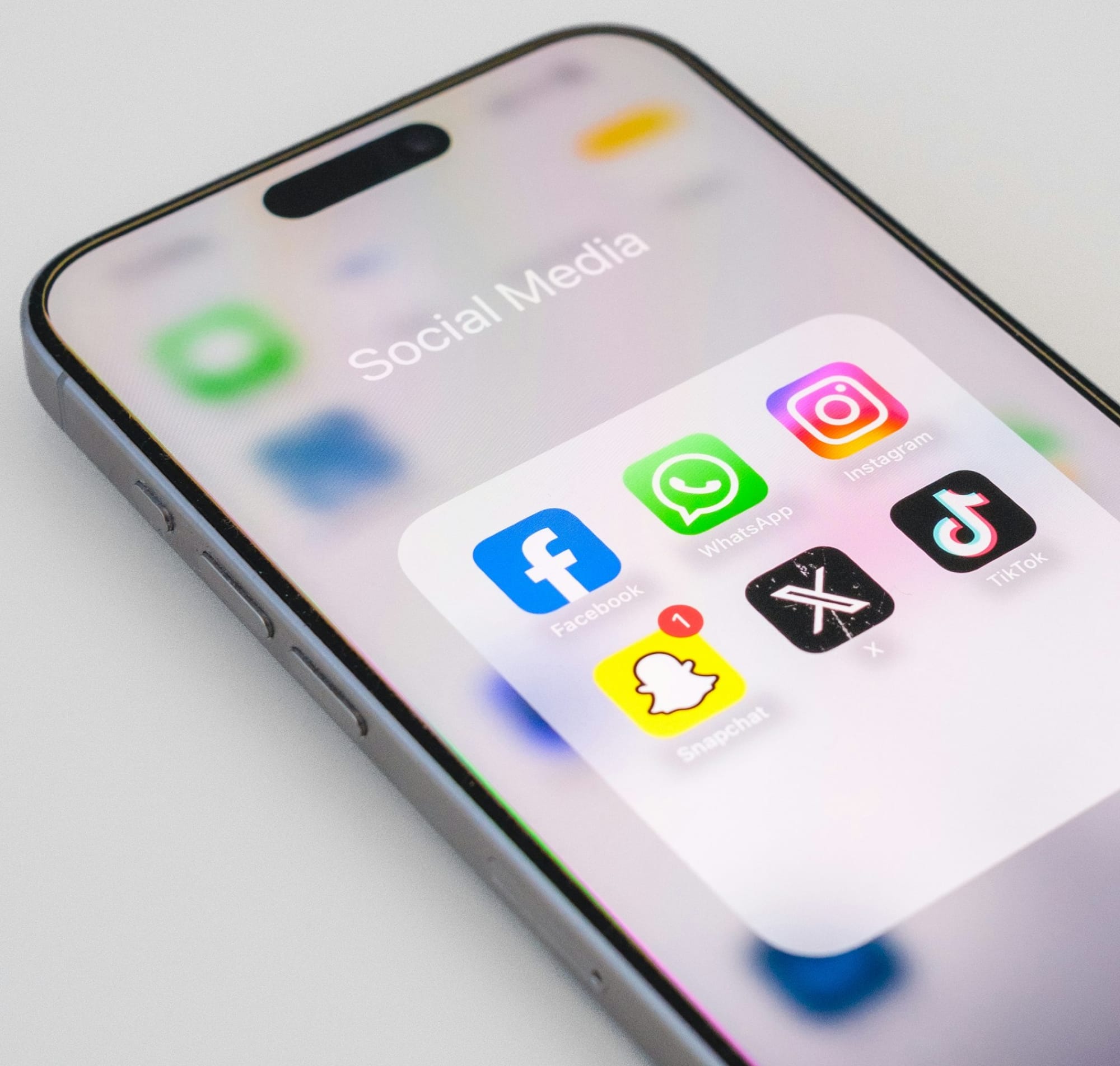 A close up of an iPhone on a white surface