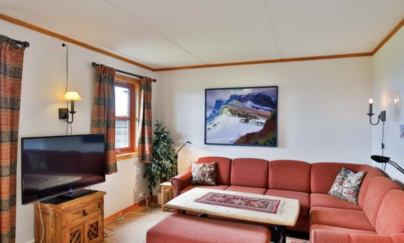 Living room with corner sofa in Beitotind 1303