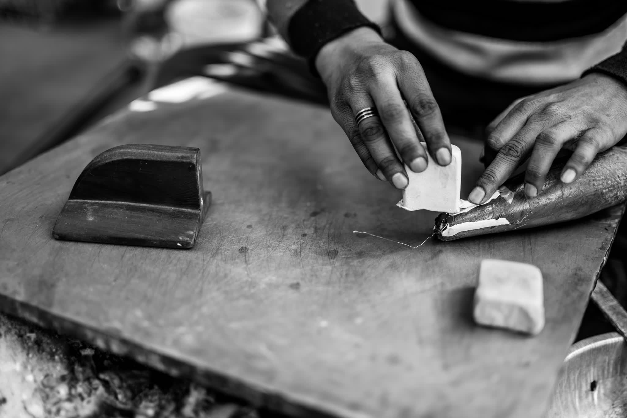 Shaping a lac bangle by hand