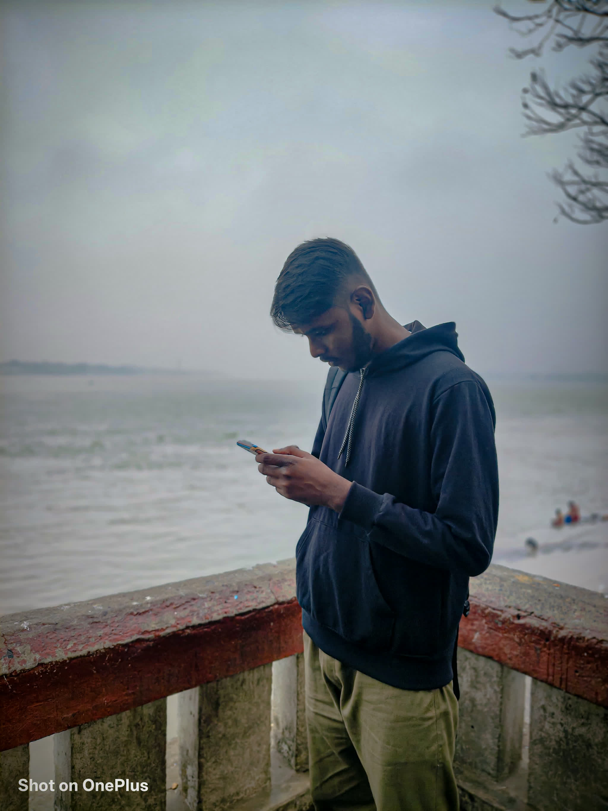 Behind the scenes — Sujal photographing by the foggy riverside