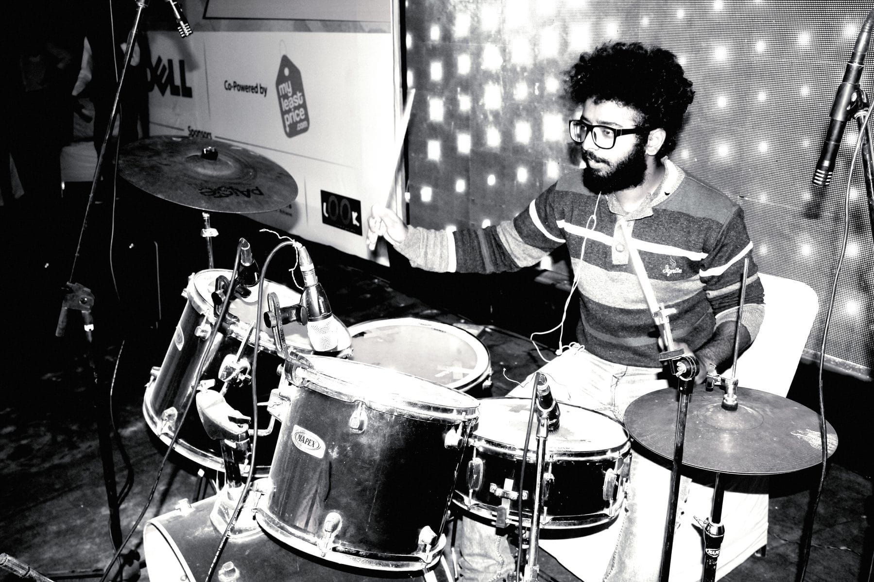 Jyotiraditya Bhujang performing live on drums during his early band years