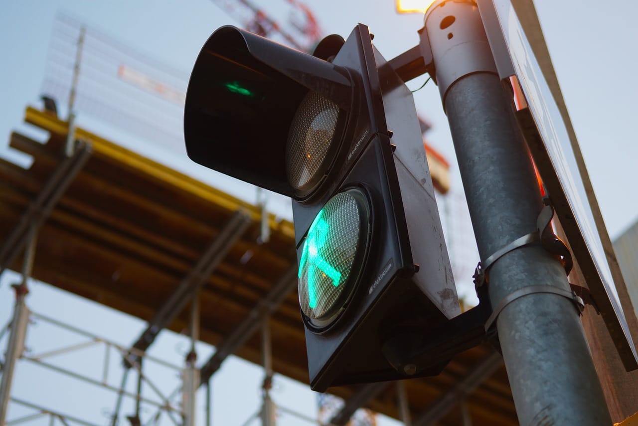 Pedestrian crossing showing a green man indicating you can cross the street