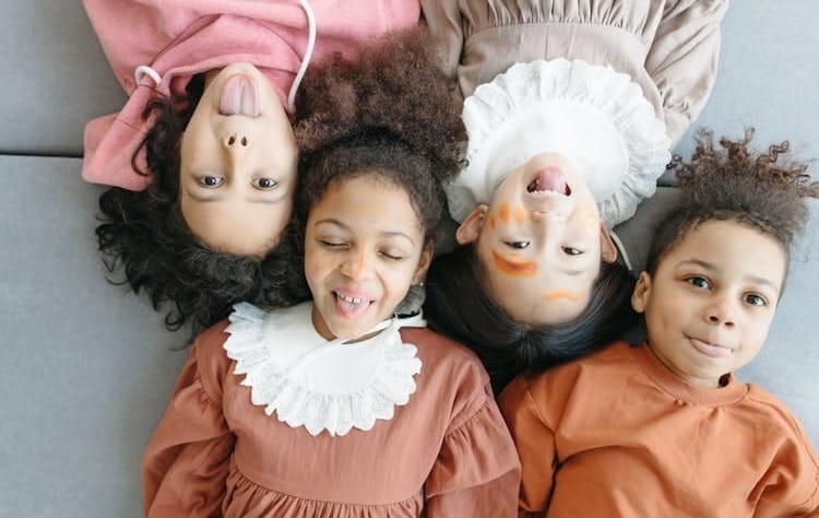Free Children Lying Close in Opposite Directions Stock Photo