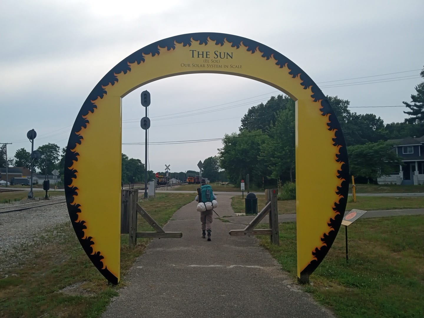 The steel Sun archway marking the start of the Our Solar System in Scale installation on the North Judson Erie Trail