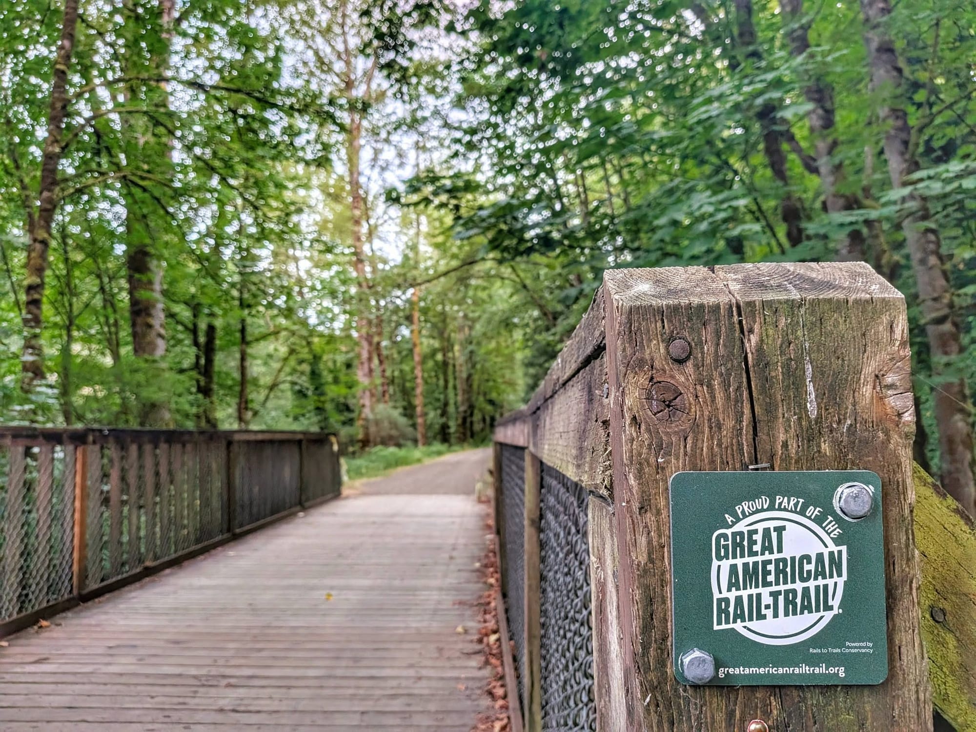 The Great American Rail-Trail sign on a Washington State trail