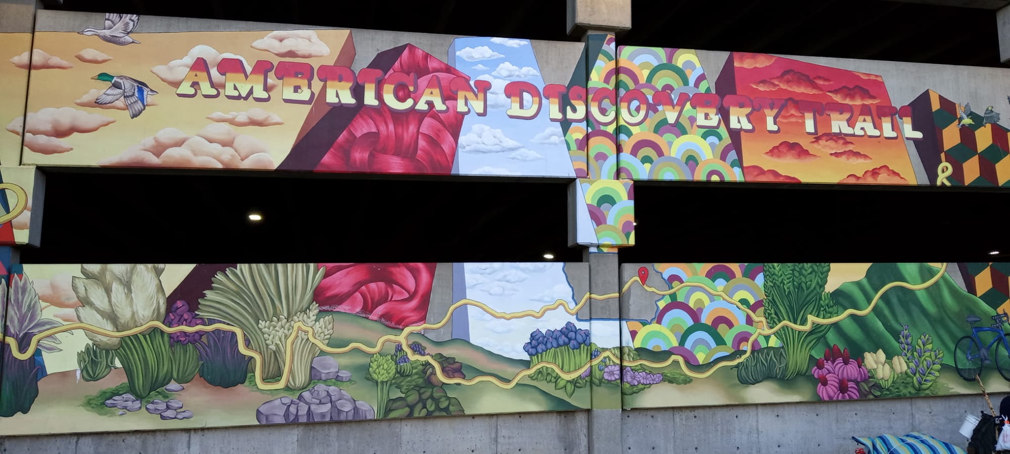 The Across Iowa mural marking the American Discovery Trail, on a parking structure facing Greene Square in Cedar Rapids