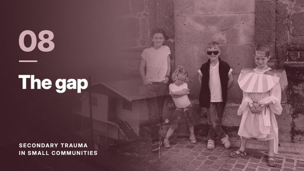 Four children against a stone wall, blended with a hillside village in fog, in a wine tone. Text: “08 The gap”, Secondary Trauma in Small Communities.