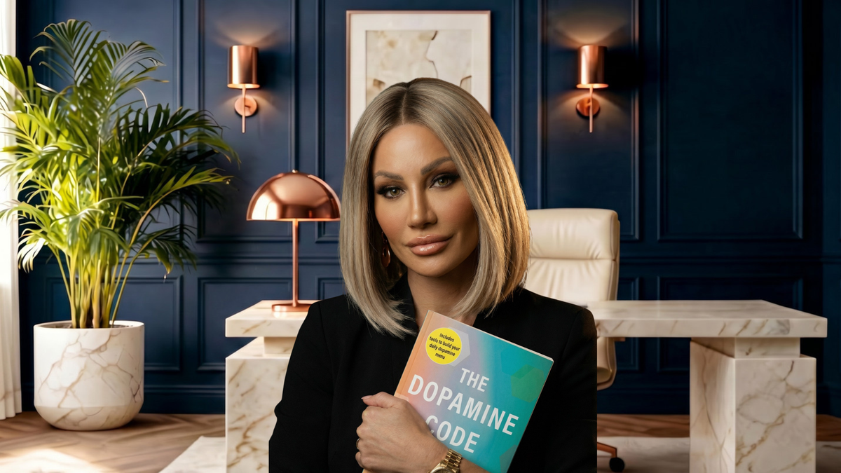 Dr. Sydney Ceruto holding her new book, The Dopamine Code, in her office — out today.