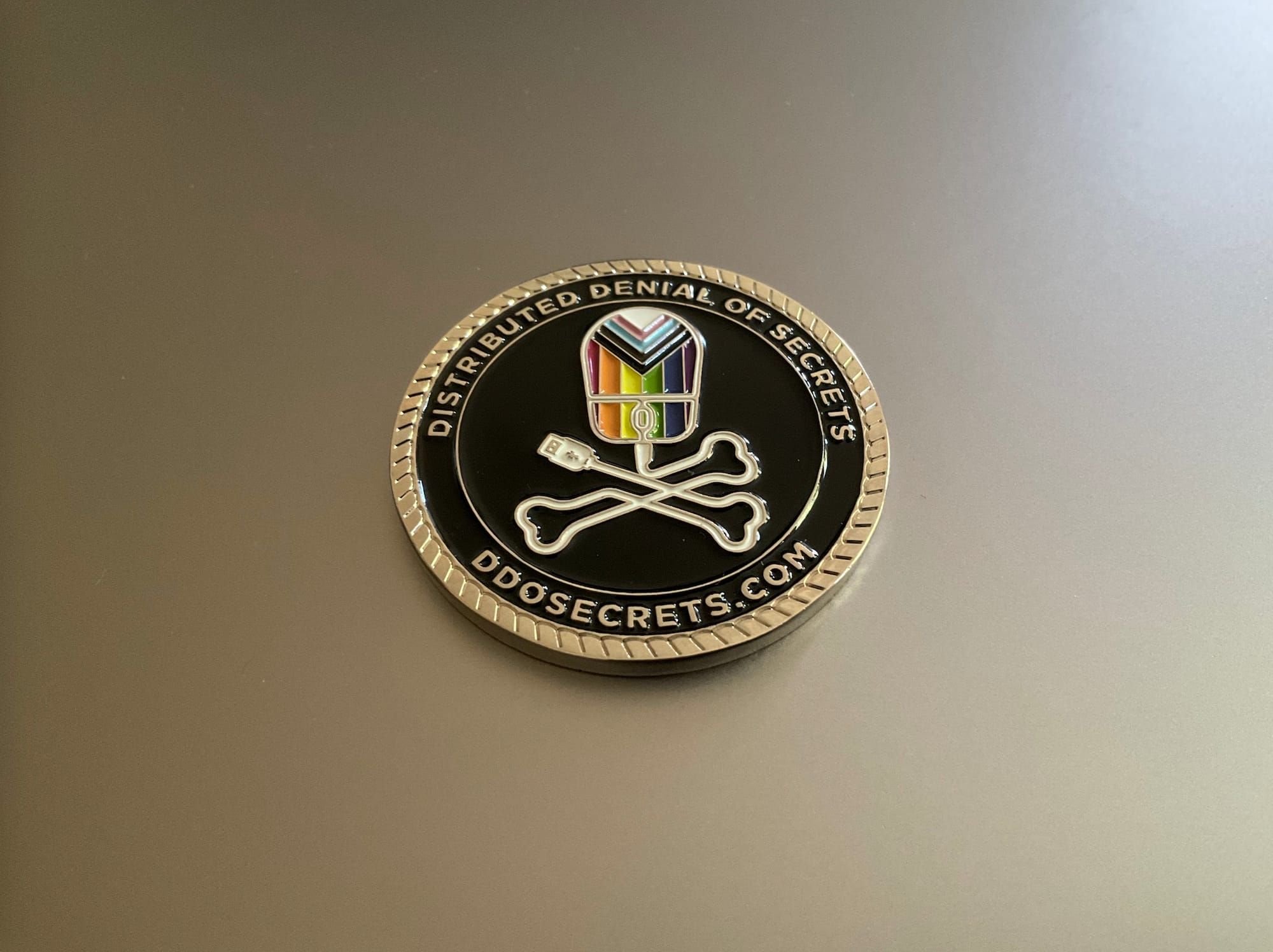 A DDoSecrets challenge coin.