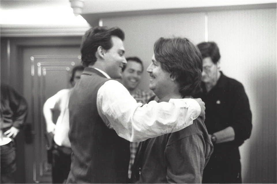 Roy and Johnny Depp embrace on the set of 'Nick of Time'