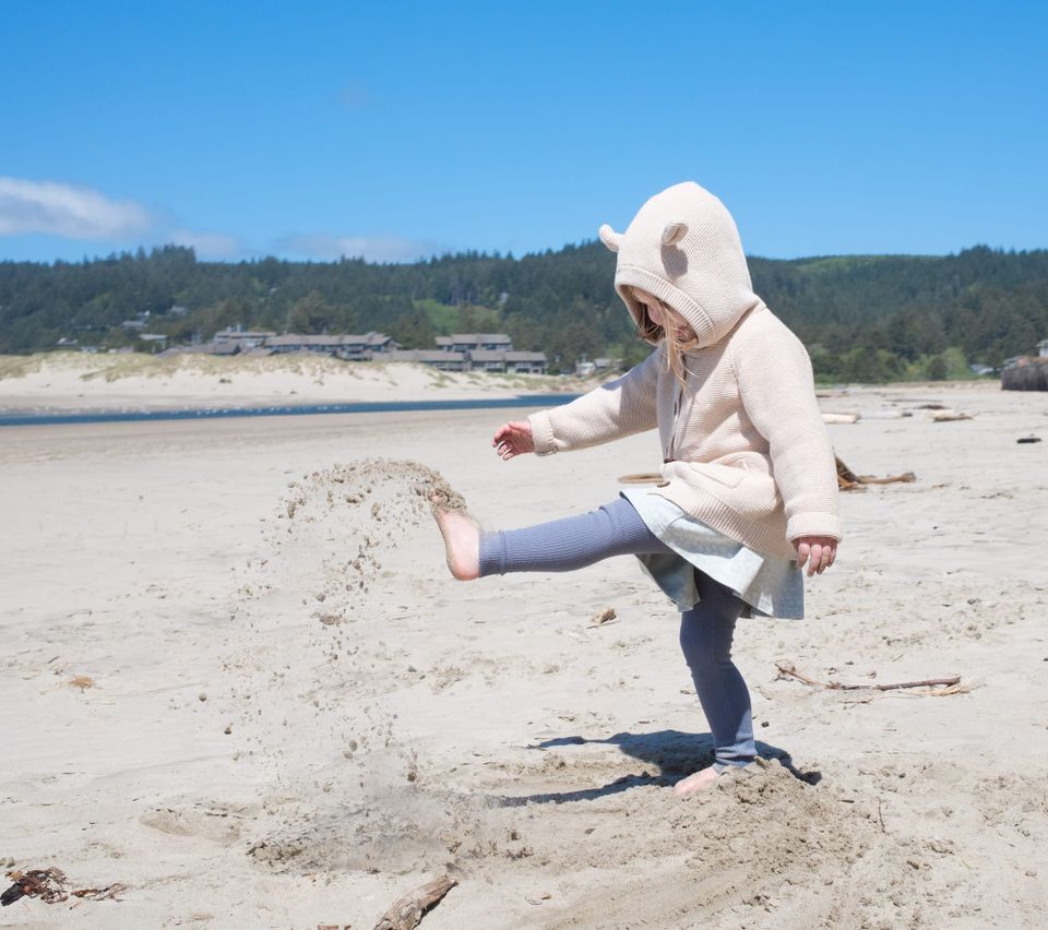My daughter kicking sand, as she does.